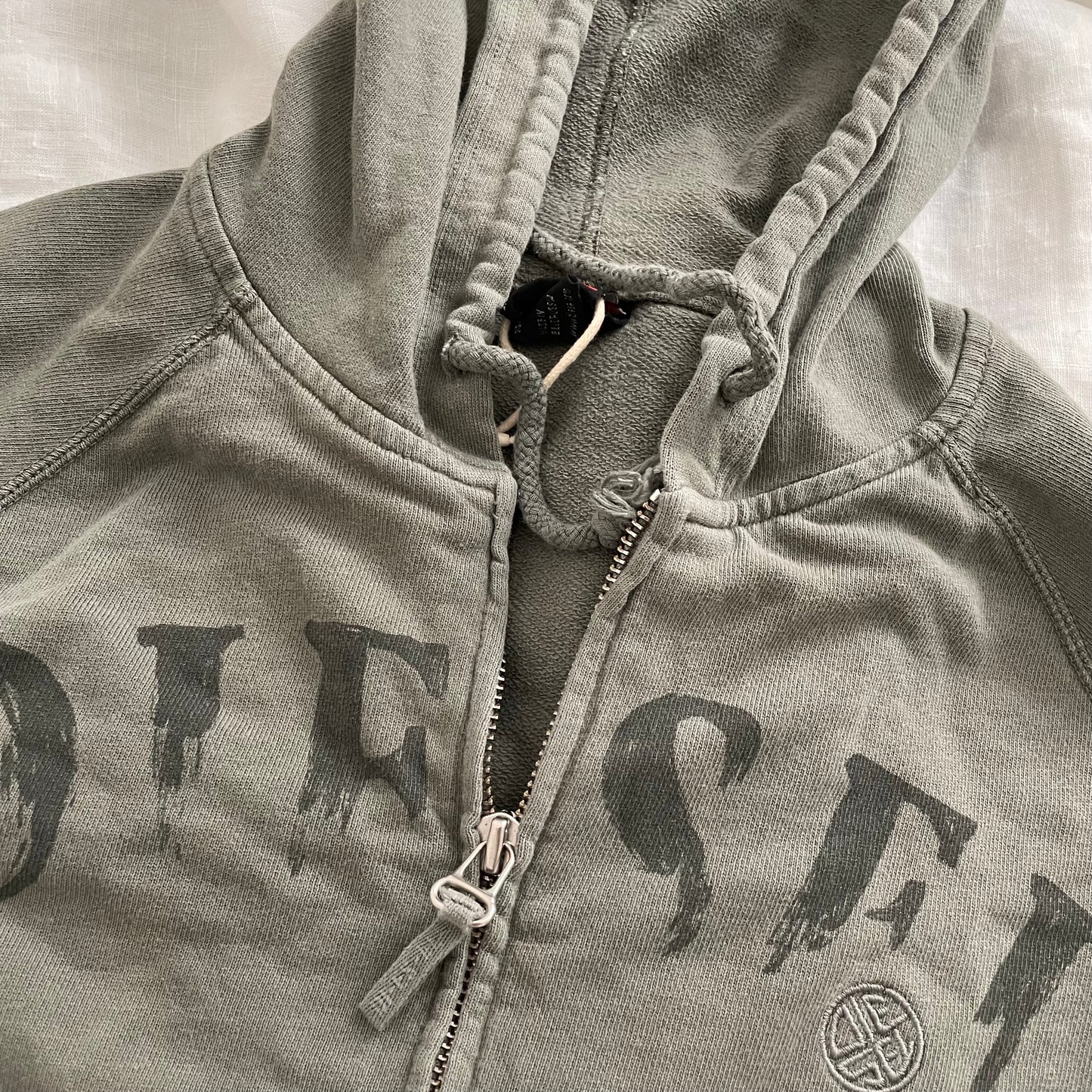 khaki grunge sleaze diesel long sleeve zip faded text hoodie jacket