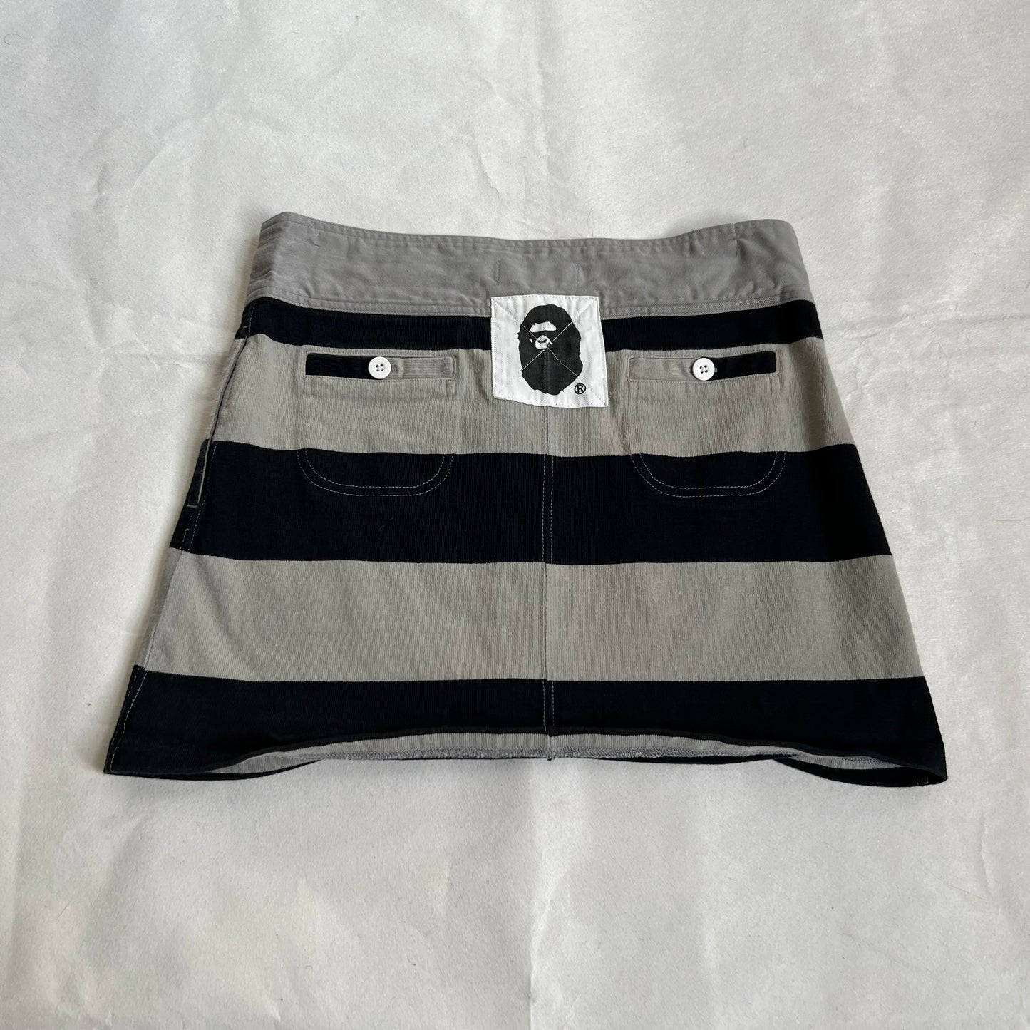 a bathing ape preppy greige black bape patch striped polo style mini skirt