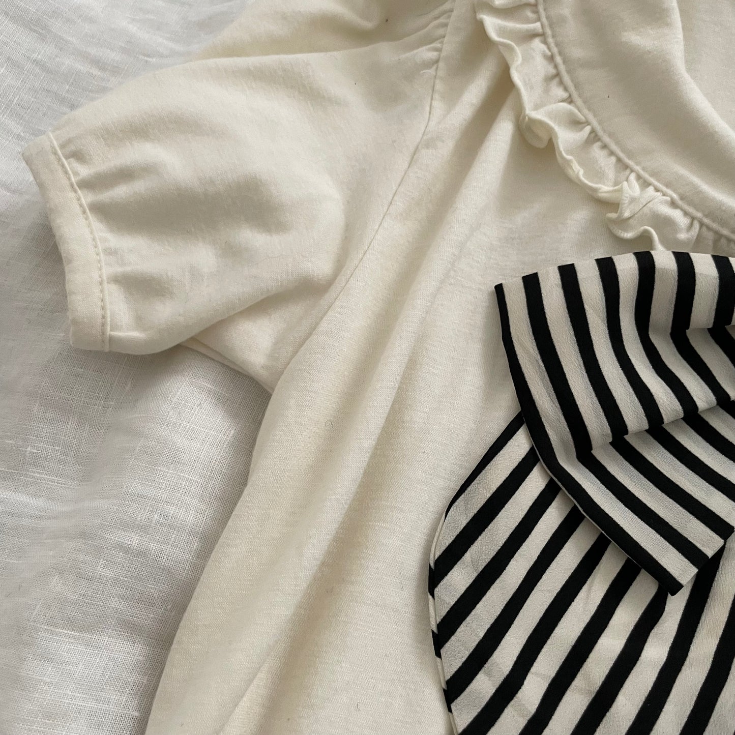 alonaquins preppy punk sailor off white puff sleeve balloon hem top with back detail and striped ribbon bow