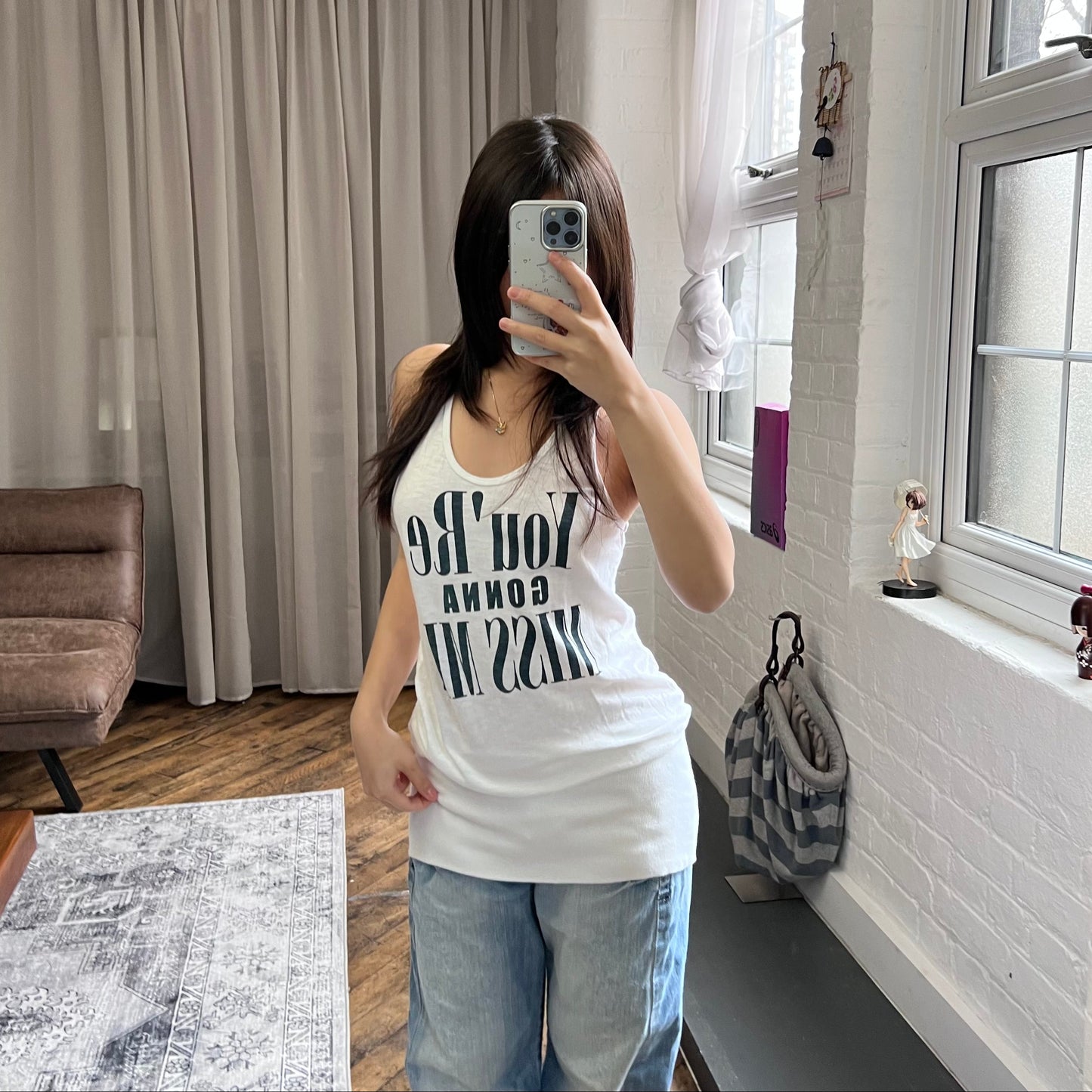 white navy fitted hem bubble long tank top with you're gonna miss me graphic