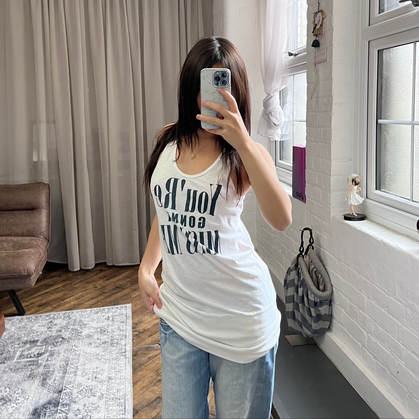 white navy fitted hem bubble long tank top with you're gonna miss me graphic