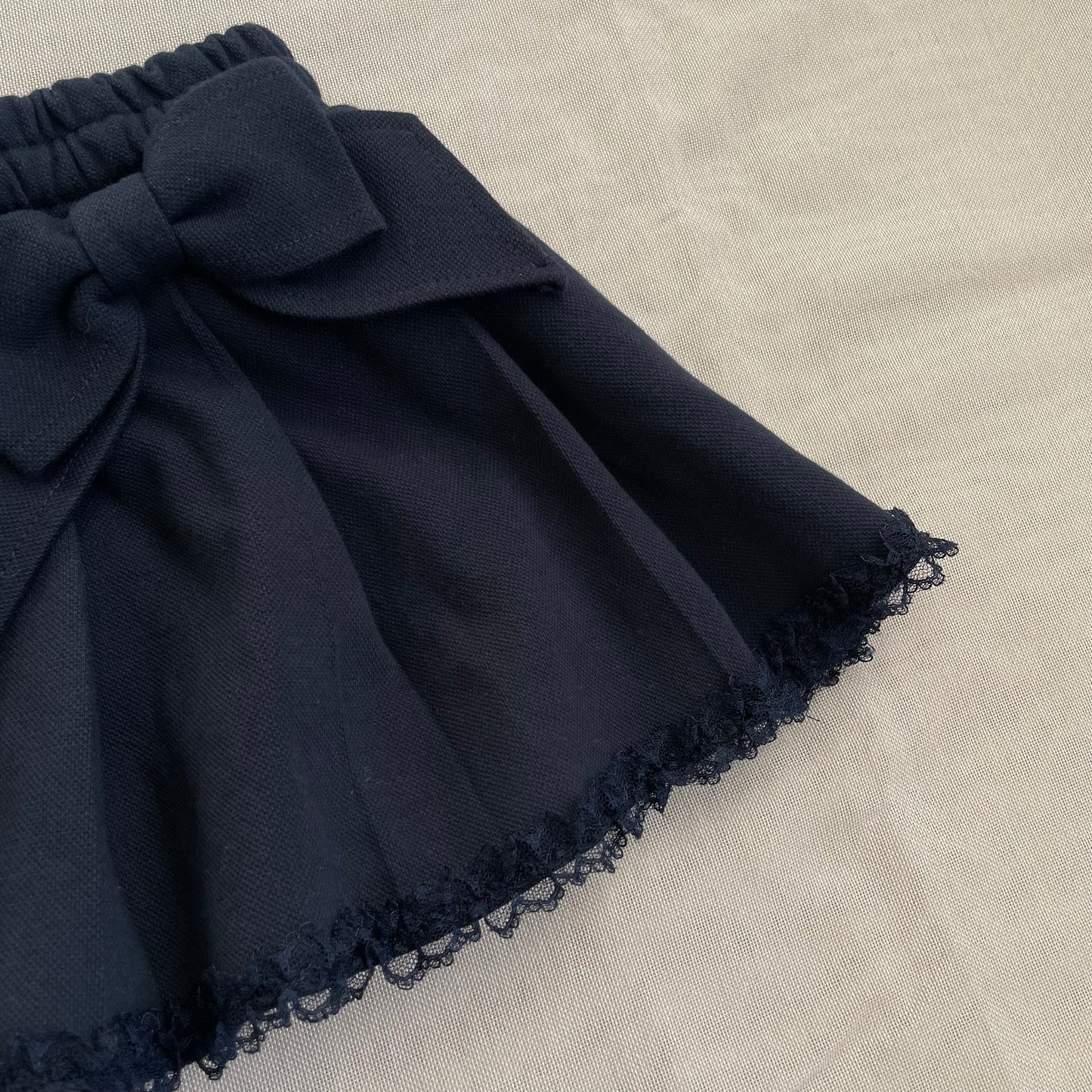 dark coquette navy pleated dual bow lacey hemline mini skirt