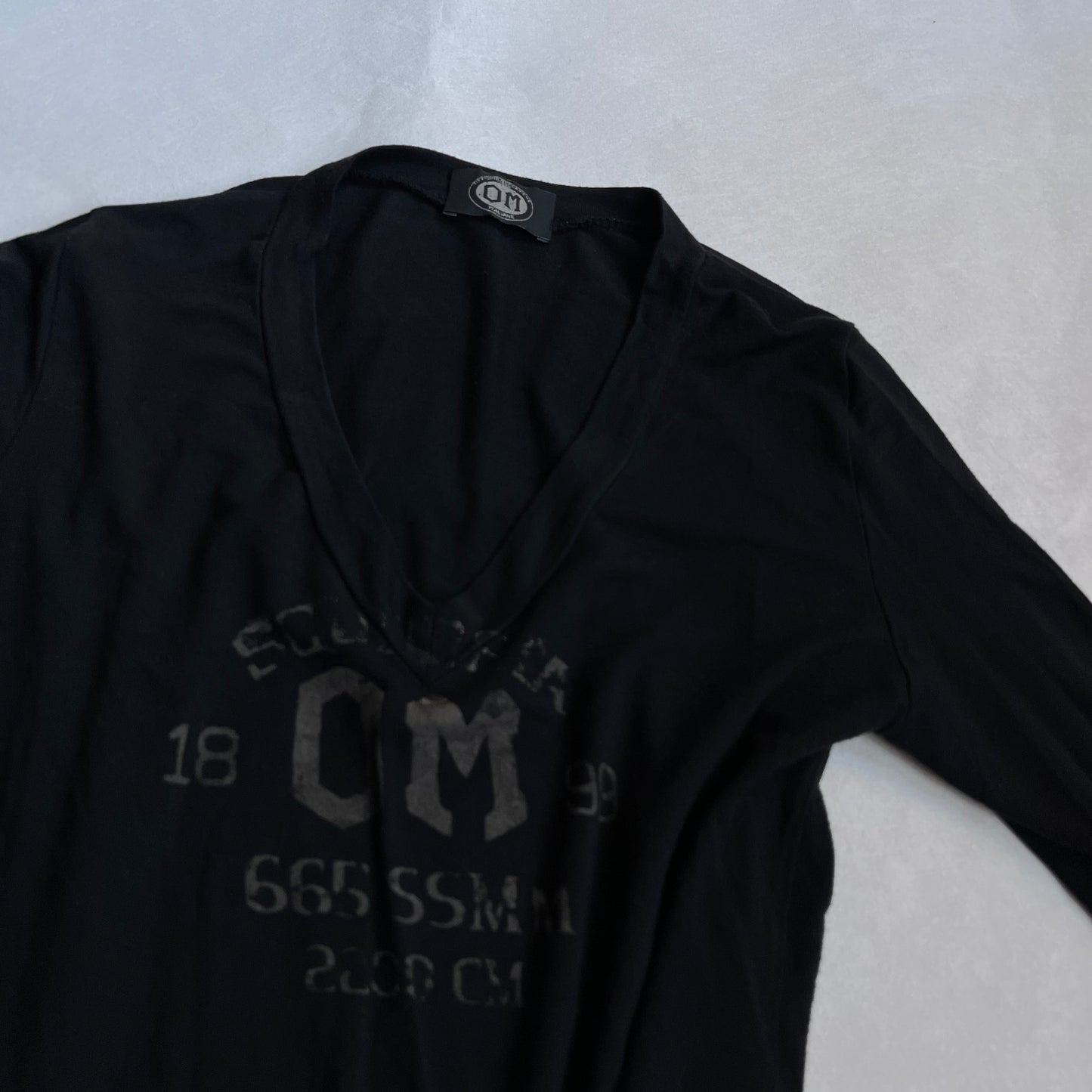 vintage faded black long sleeve v neck beige graphic shirt