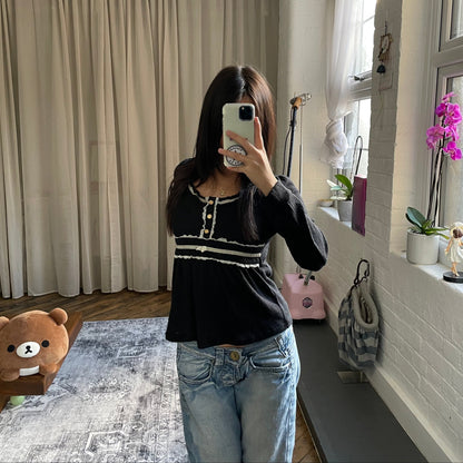 dosch black white lacey trim button accent long sleeve top