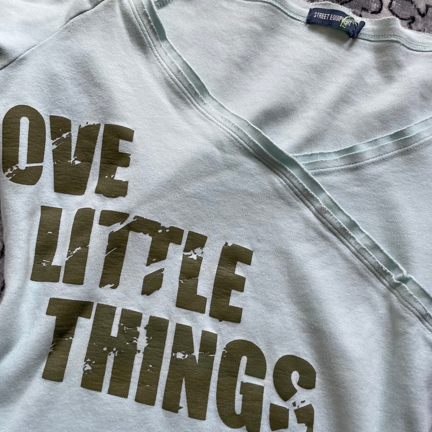 baby blue sporty street equipment khaki graphic text wrap style long sleeve shirt