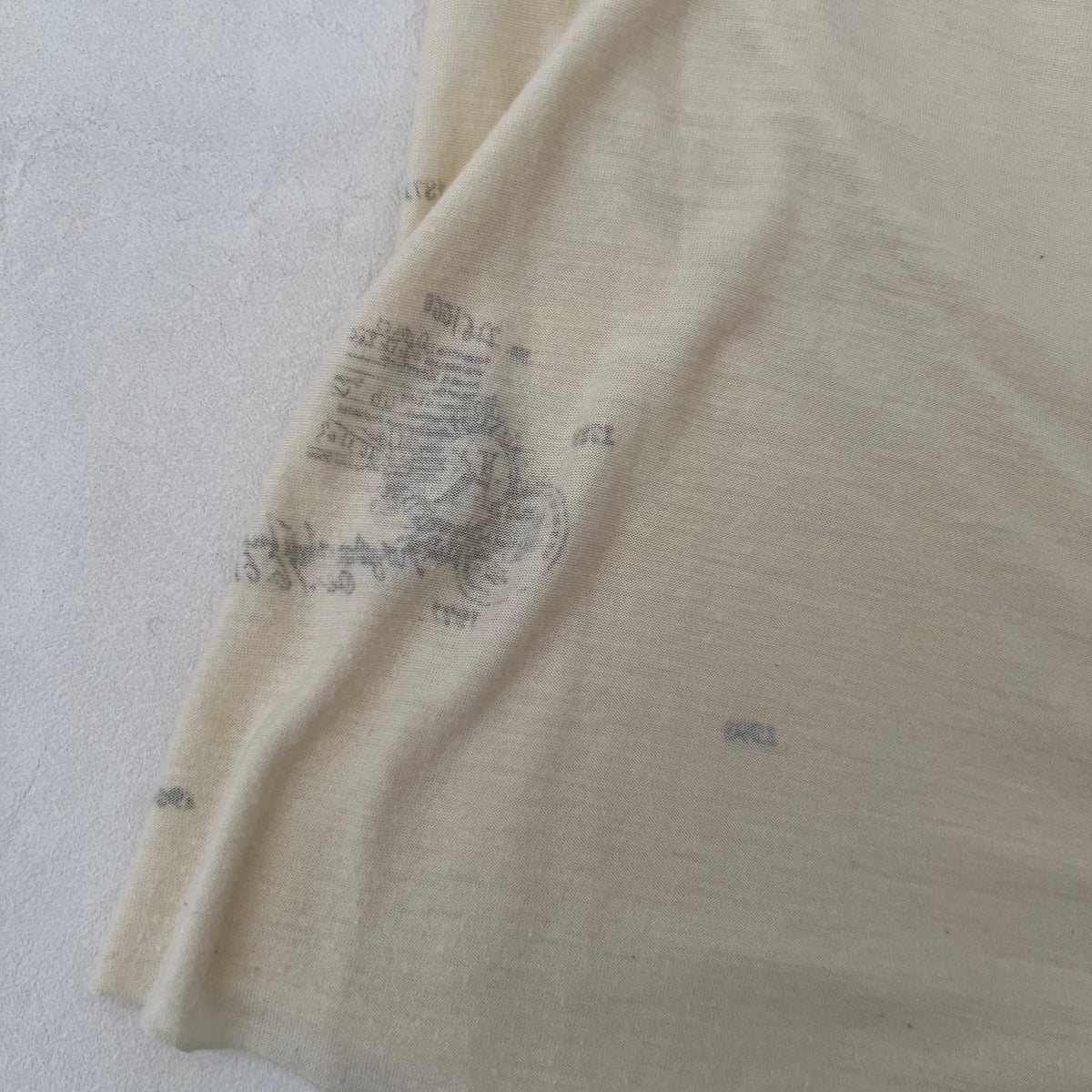 Cream V Neck Faded Graphic Vest