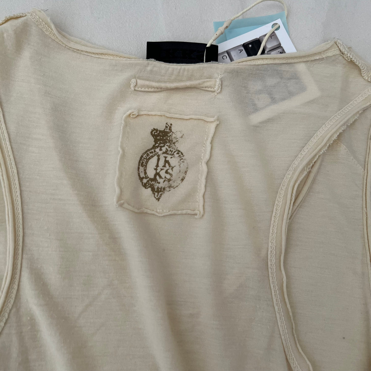 Cream V Neck Faded Graphic Vest