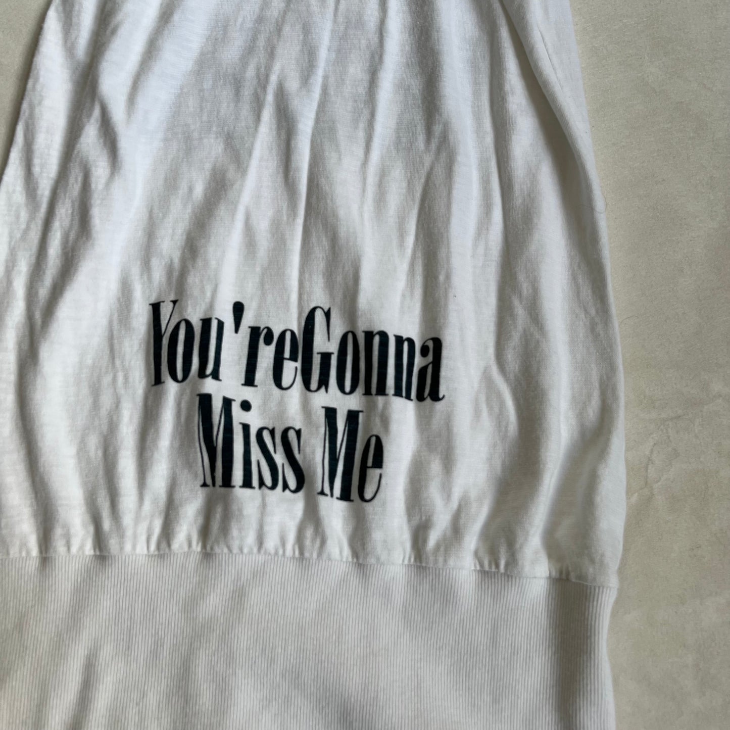 white navy fitted hem bubble long tank top with you're gonna miss me graphic