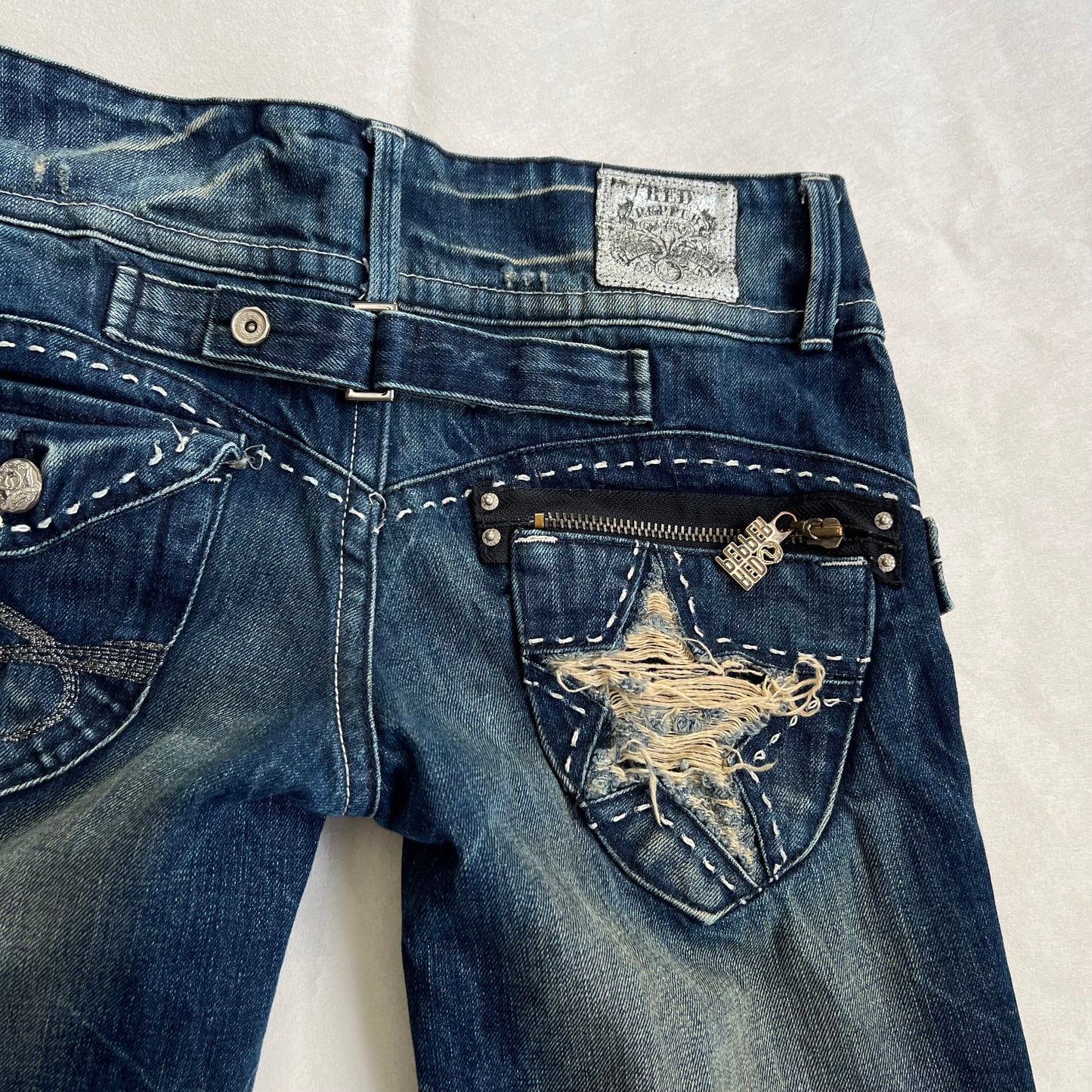 red pepper medium wash denim low mid rise distressed star wide leg trousers