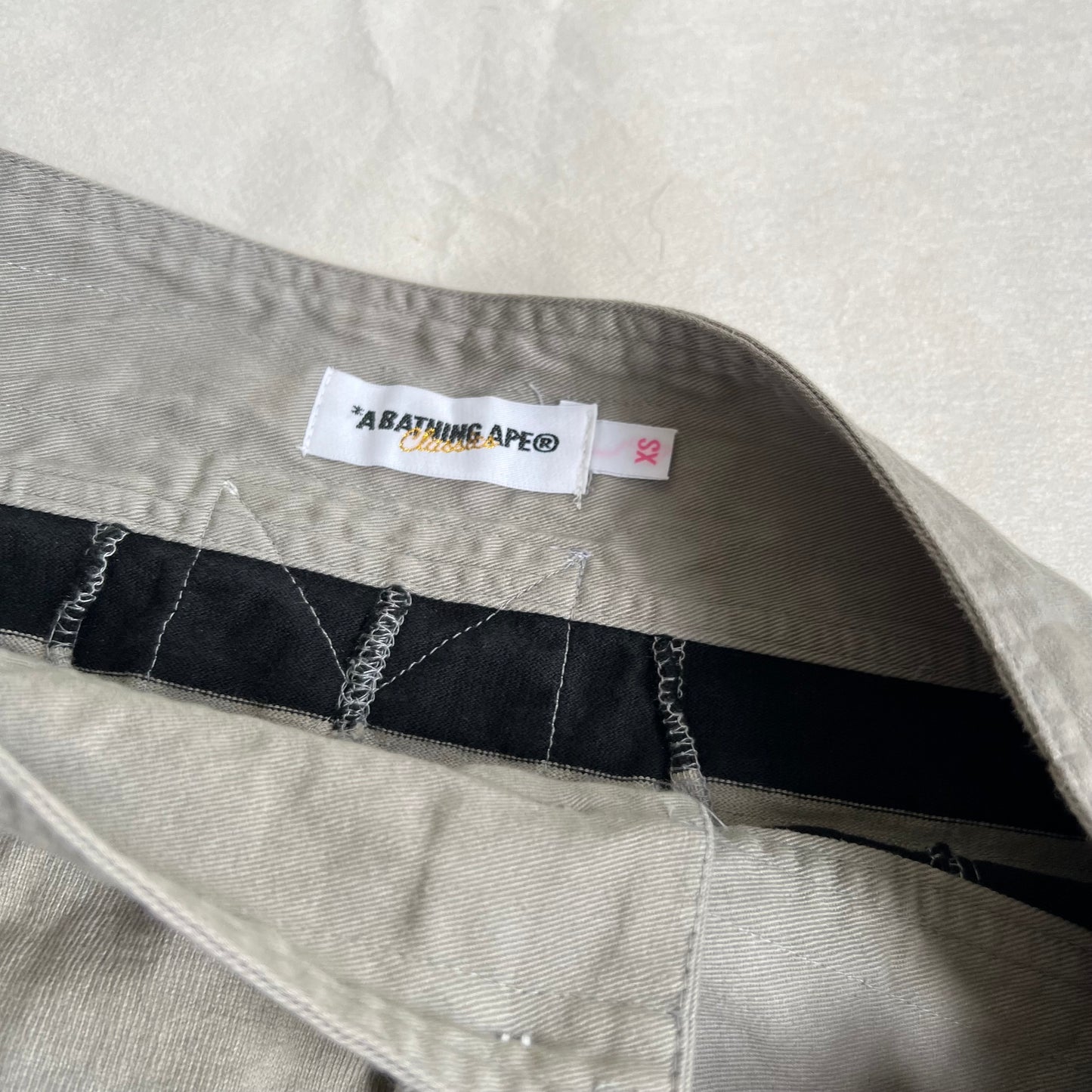 a bathing ape preppy greige black bape patch striped polo style mini skirt