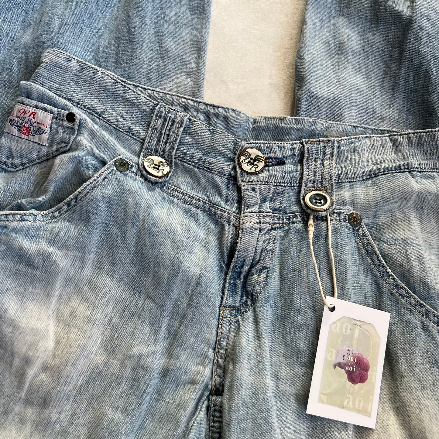 replay light wash denim baggy straight leg faux rip adjustable cinched hem jeans