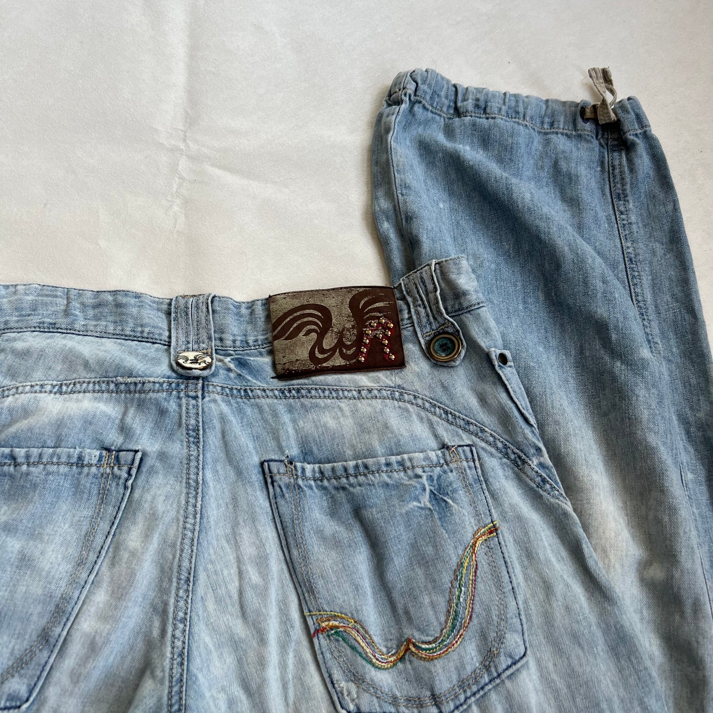 replay light wash denim baggy straight leg faux rip adjustable cinched hem jeans