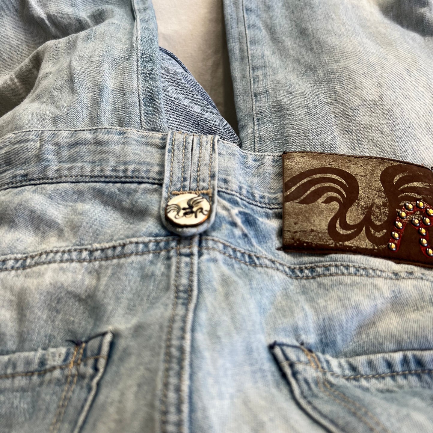 replay light wash denim baggy straight leg faux rip adjustable cinched hem jeans