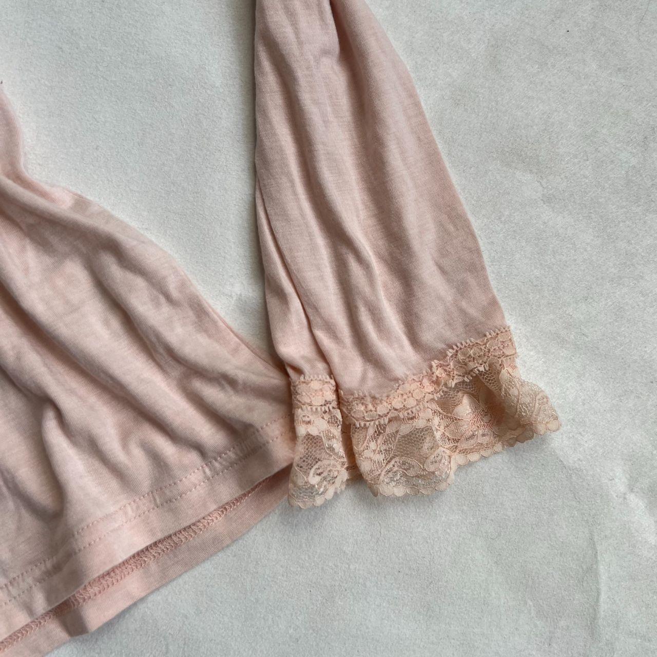 coquette angelic pink long sleeve liz lisa lacey square neck top with criss cross back detailing and frilly sleeve hem